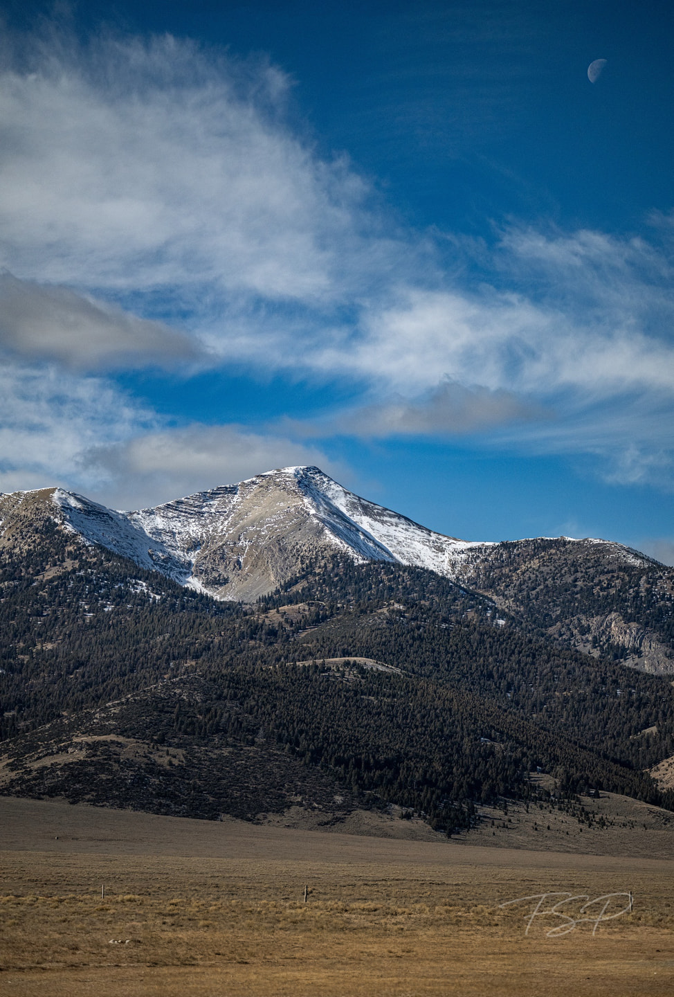 Moon over the Bitterroot Mountains, photographed by Fletcher Shepley-McTaggart